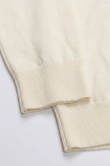 Pull à col roulé crème pour homme, en maille douce à manches longues et mélange de viscose.