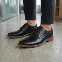 Chaussures Derby habillées pour hommes en cuir noir poli, unies