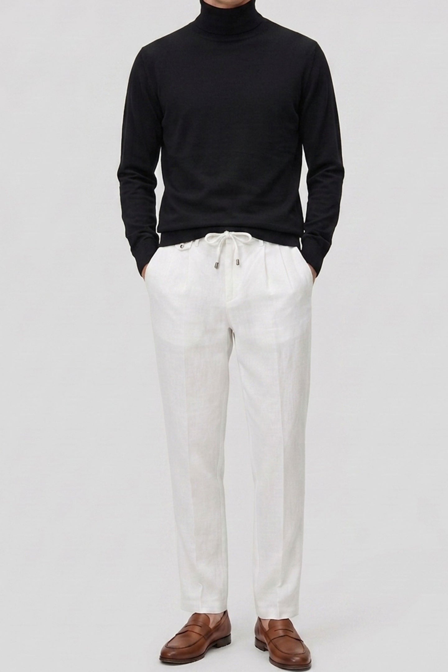 Pull à col roulé noir pour homme, en maille douce à manches longues et mélange de viscose.