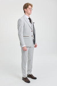 Costume trois pièces en tweed à carreaux gris pierre pour homme Mark, avec finitions marron, idéal pour les mariages et les bals de fin d'année.