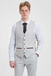 Costume trois pièces en tweed à carreaux gris pierre pour homme Mark, avec finitions marron, idéal pour les mariages et les bals de fin d'année.