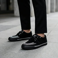 Baskets Creeper pointues à plateforme en daim noir et blanc